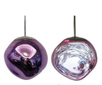 The Clérachic melt pendant in purple, mirrored shell beside the lit rippled version.
