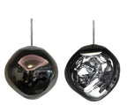 Clérachic melt pendant in black chrome, mirrored shell beside its lit smoky form.