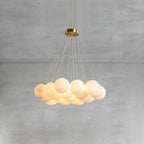 Clérachic drops a broad Norduvyd on long wires, the alabaster spheres spreading out like a low bank of cloud.