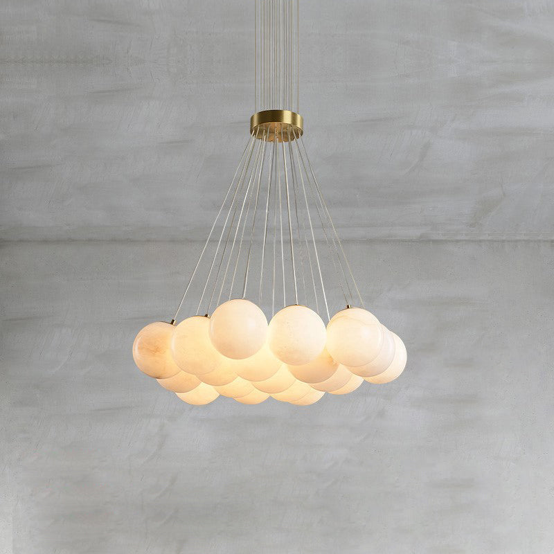 Clérachic drops a broad Norduvyd on long wires, the alabaster spheres spreading out like a low bank of cloud.
