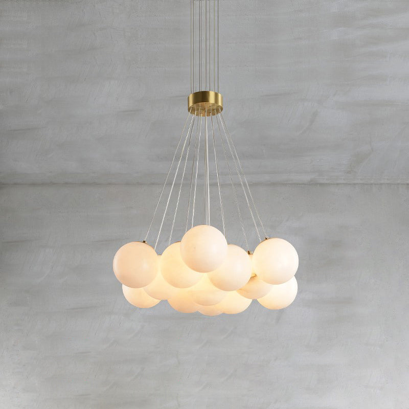 Clérachic lights the Norduvyd from within, warm light pooling through each hand-shaped alabaster sphere.