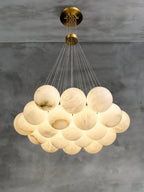 Clérachic lights the Norduvyd from a low angle, the deep cluster glowing amber through layered alabaster stone.