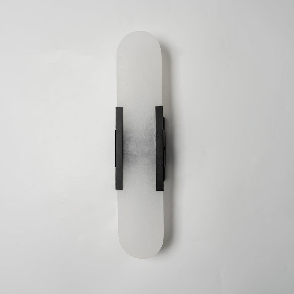 Clérachic sconce turned slightly, unlit, the dark bars and cloudy stone shown against plain white