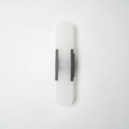 Clérachic sconce unlit with dark bars, centred on white to show the slim rectangular mount