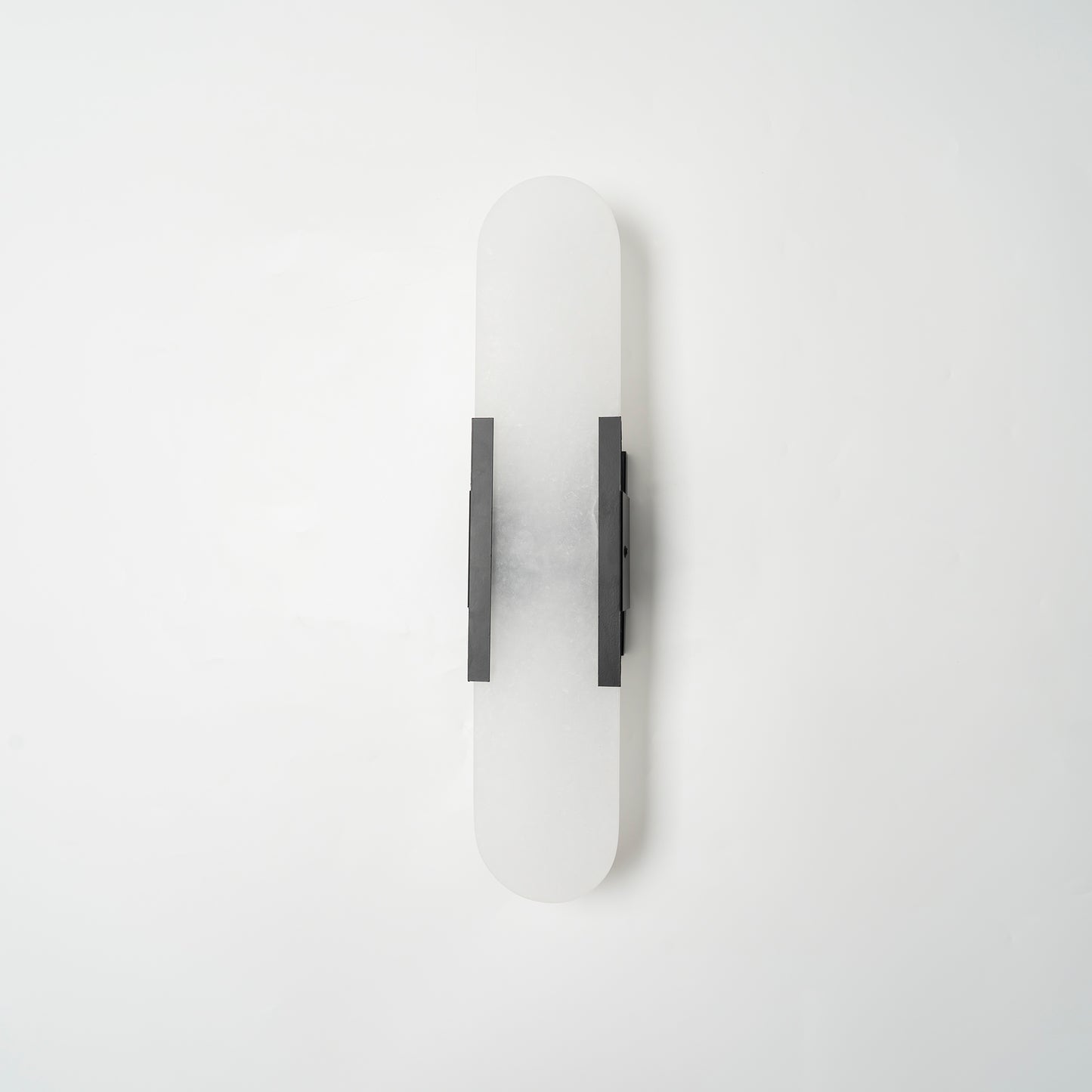 Clérachic sconce unlit with dark bars, centred on white to show the slim rectangular mount