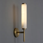 The Clérachic Olrinyra in brass seen from the side, the alabaster cylinder seated on its slim level arm.
