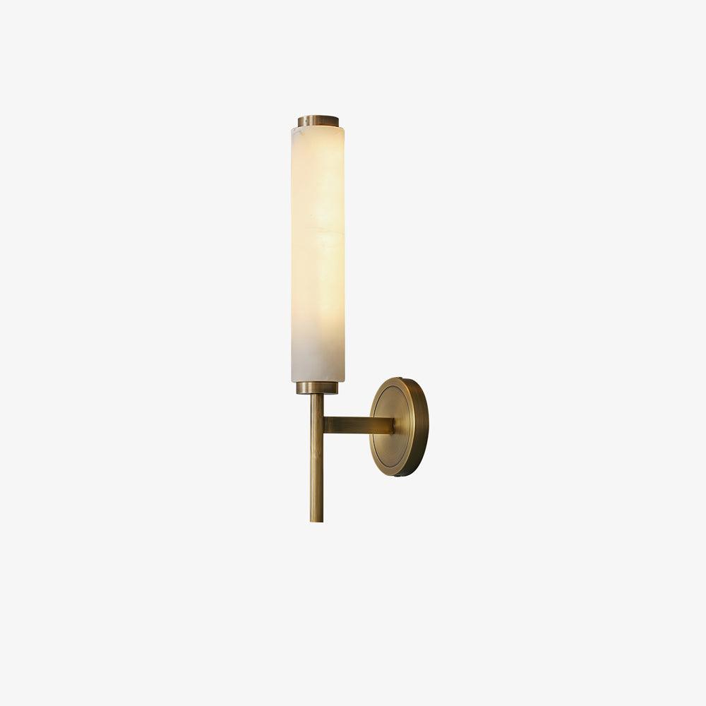 The Clérachic Olrinyra in brass on white, lit, showing the warm tone the alabaster gives off when switched on.