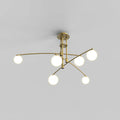 Gold Clérachic chandelier with six opal globes on crossing arms, lit, on a plain grey backdrop.