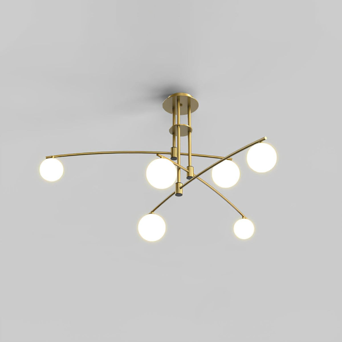 Gold Clérachic chandelier with six opal globes on crossing arms, lit, on a plain grey backdrop.