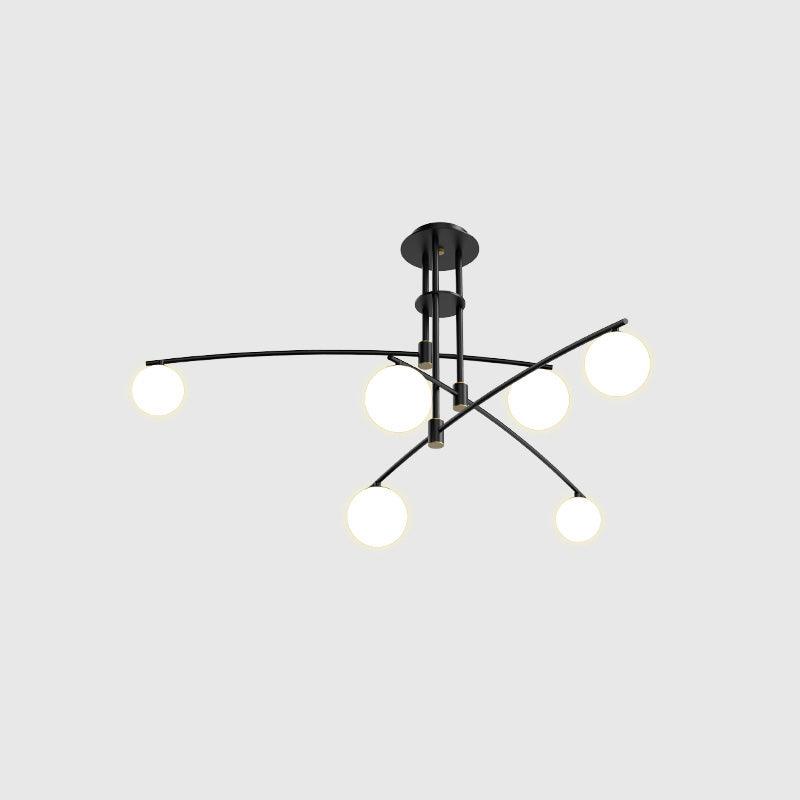 Black Clérachic chandelier with six opal globes on thin crossing arms, lit, on a pale grey backdrop.