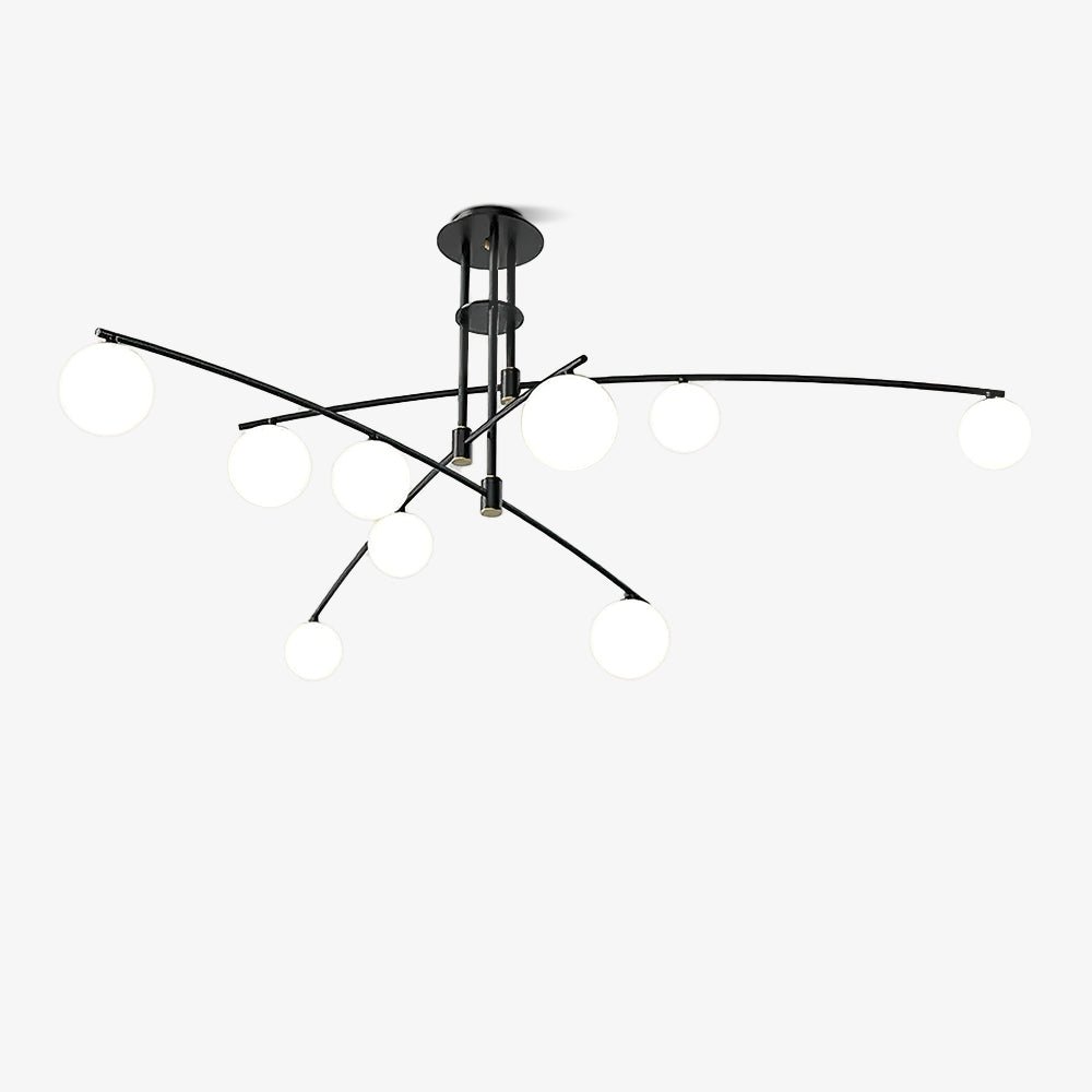 Black Clérachic chandelier seen from a low side angle, with globes of mixed sizes on sweeping arms, on a white backdrop.