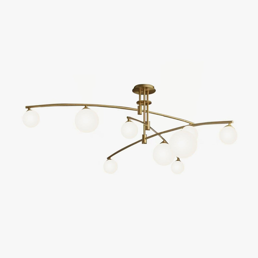 Gold Clérachic chandelier with frosted globes at the ends of long curved arms, shown from a low angle on a white backdrop.