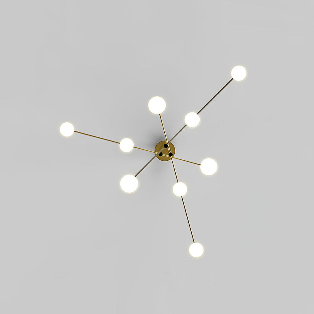 View from below of the Clérachic gold chandelier, its arms spreading from the centre like a star with a lit globe at each end.