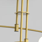 Close view of the Clérachic chandelier's central rods, a brass disc and the clamp where an arm joins the stem.