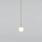 Small opal sphere on a long brass rod, this Clérachic pendant on a light grey backdrop.