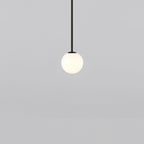 Opal sphere on a short black rod, this Clérachic pendant on a light grey backdrop.
