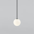 Medium opal sphere on a black rod, this Clérachic pendant shown on a light grey backdrop.