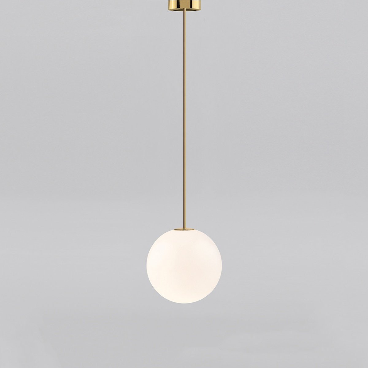 Medium opal sphere on a brass rod with a brass cap at the ceiling, this Clérachic pendant on a light grey backdrop.
