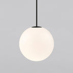 Very large opal sphere on a black rod, this Clérachic pendant filling most of the frame on a light grey backdrop.