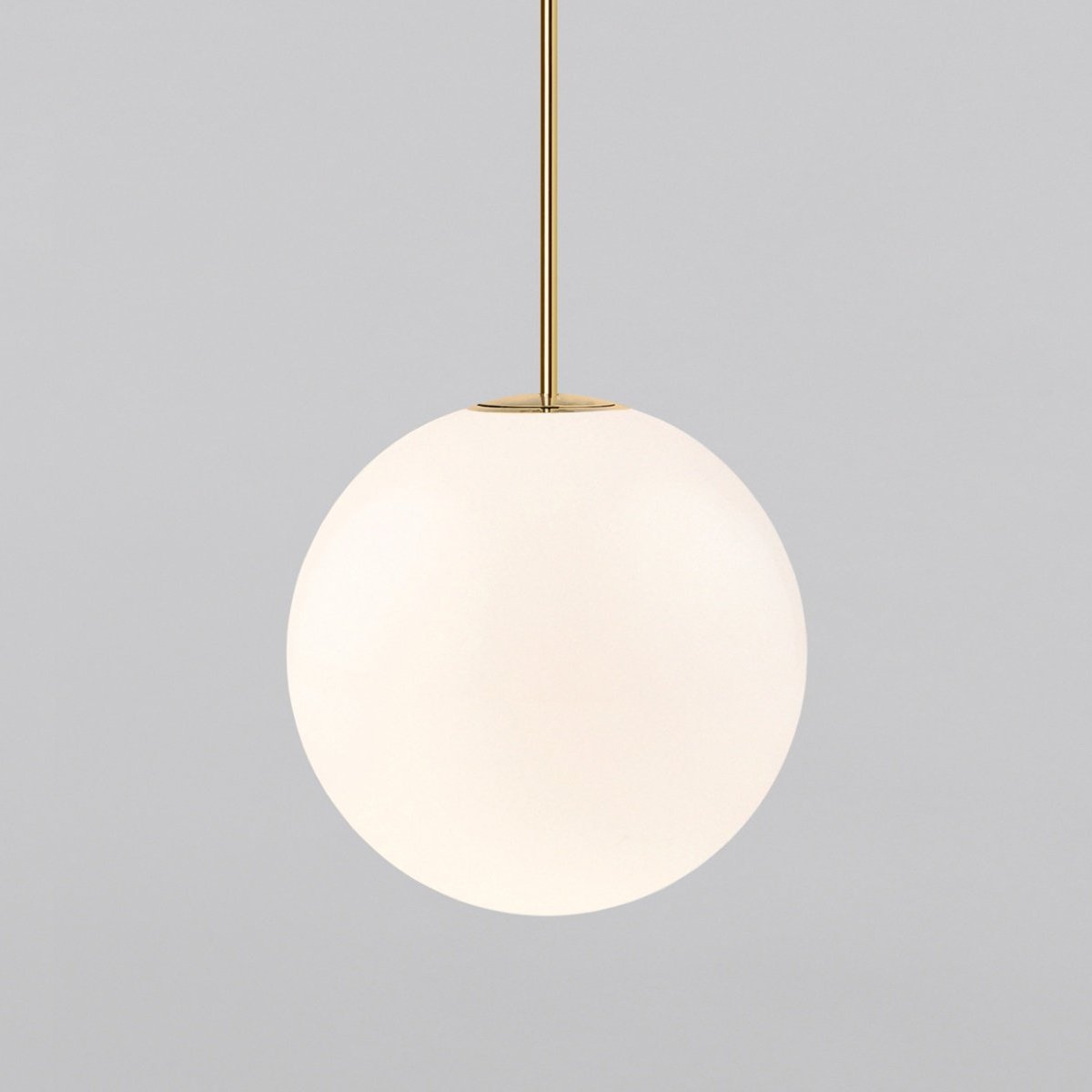 Large opal sphere on a brass rod, this Clérachic pendant filling most of the frame on a light grey backdrop.