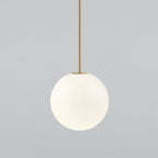Medium-large opal sphere on a brass rod, this Clérachic pendant shown on a light grey backdrop.