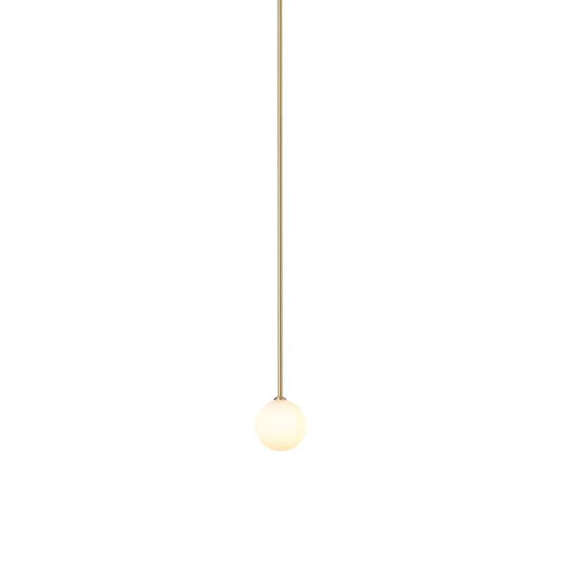Lit opal sphere hanging from a very long brass rod, this Clérachic pendant on a white backdrop.