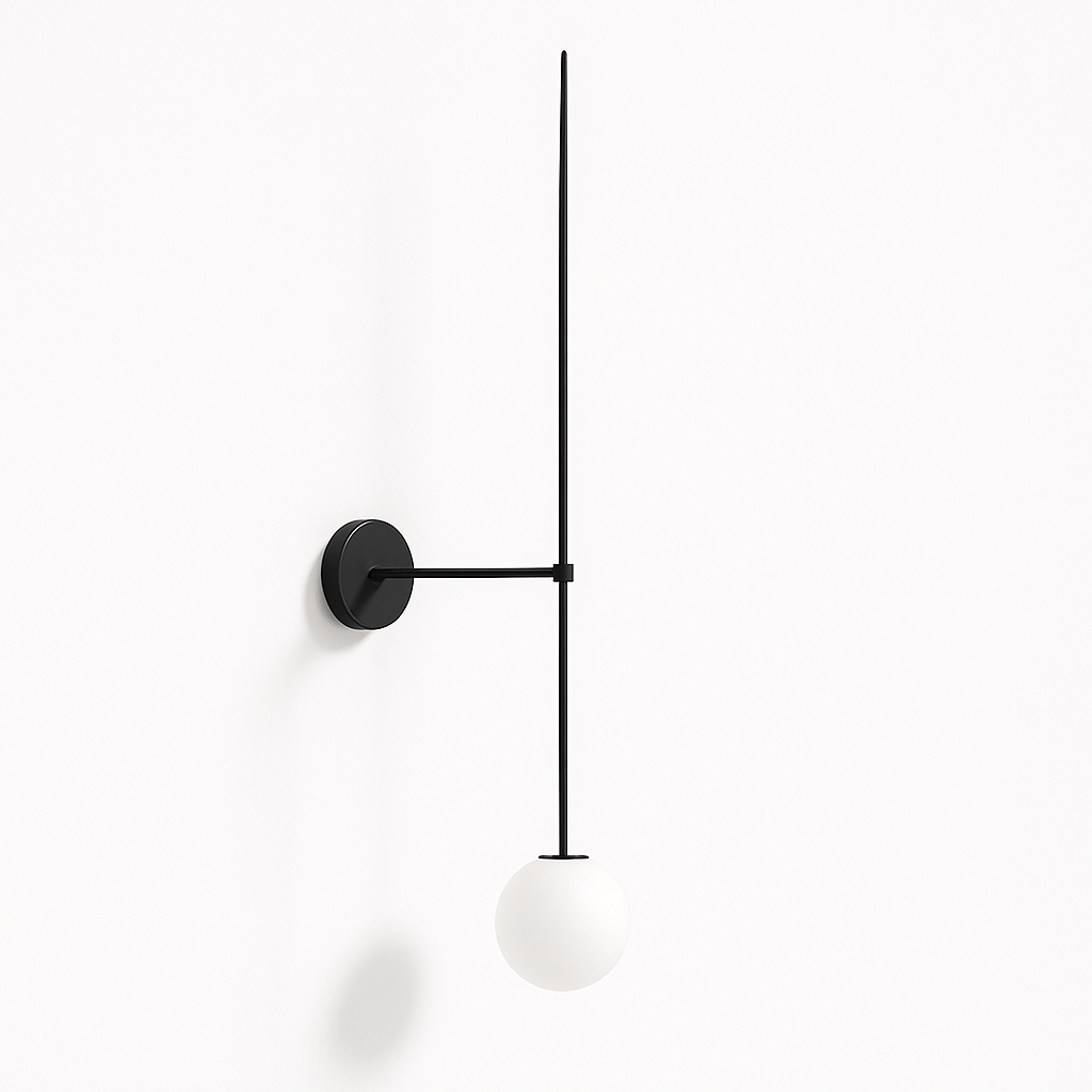 Clérachic black wall light with a long slim iron rod and a round white opal glass globe on a plain white wall.