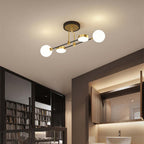 The Clérachic Opal Globe Ceiling Light in its slim 4-light bar layout, mounted over a bathroom vanity beside an open bookshelf.