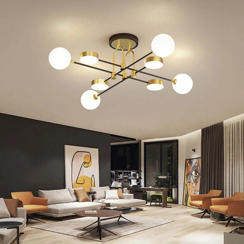 The Clérachic Opal Globe Ceiling Light hanging over a dark accent wall with abstract line art and mustard armchairs beneath it.