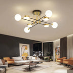 The Clérachic Opal Globe Ceiling Light hanging over a dark accent wall with abstract line art and mustard armchairs beneath it.