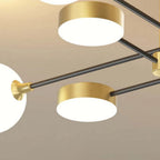 Close-up of the Clérachic Opal Globe Ceiling Light's brushed-gold disc heads and matte-black crossed arms, with an opal globe beside them.