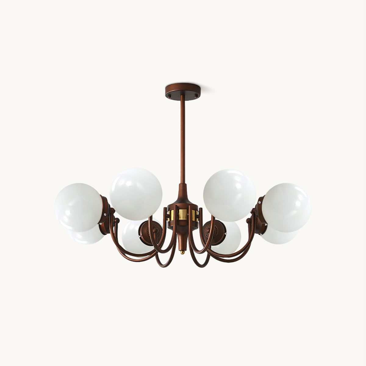 Eight-light Clérachic chandelier with white glass globes on curved antique bronze arms and a short rod, on a plain white backdrop.