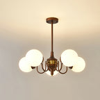 Five-globe Clérachic chandelier on a short rod, lit against a pale ceiling with a warm glow.