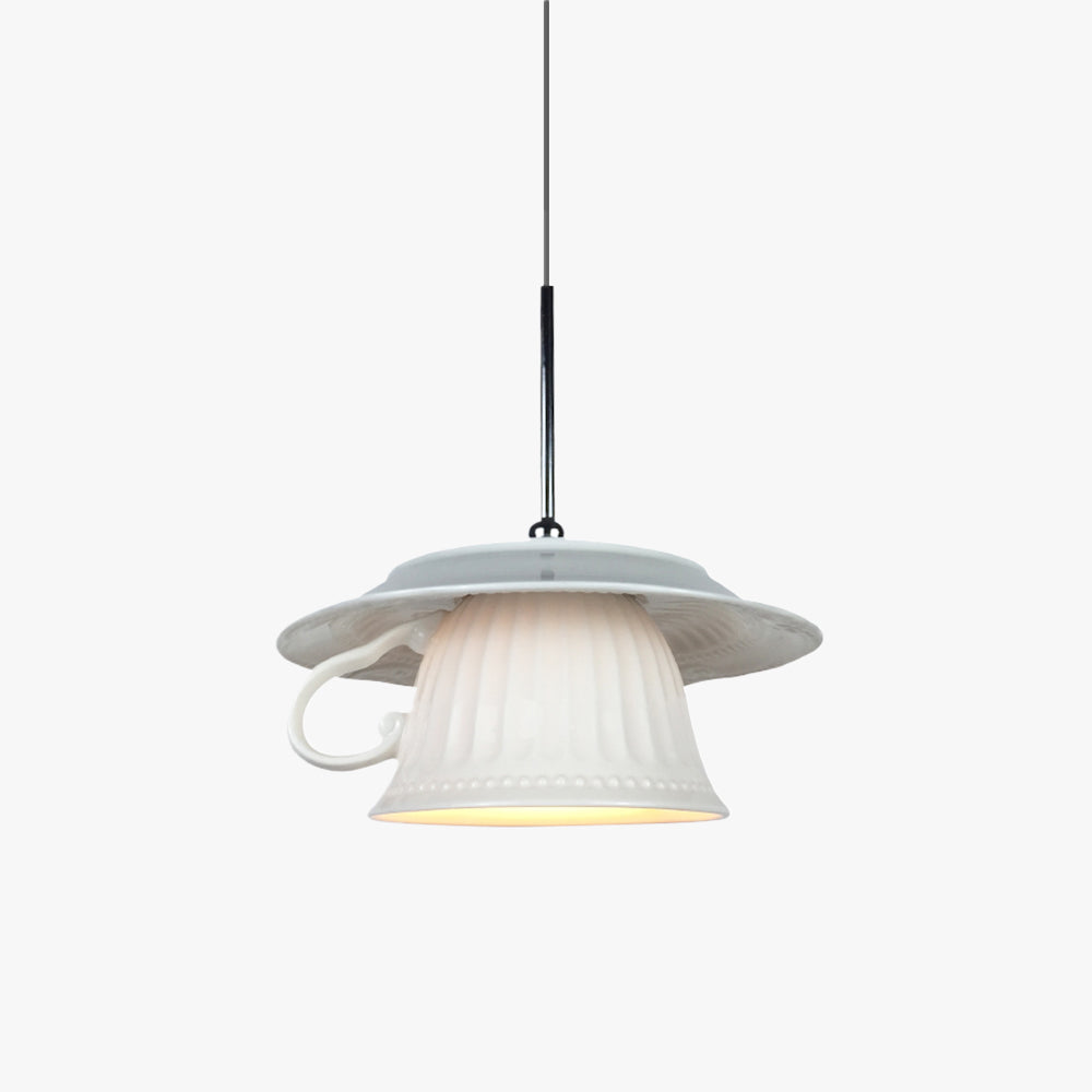 Clérachic pendant light lit, the glow through the shade in a quiet room.