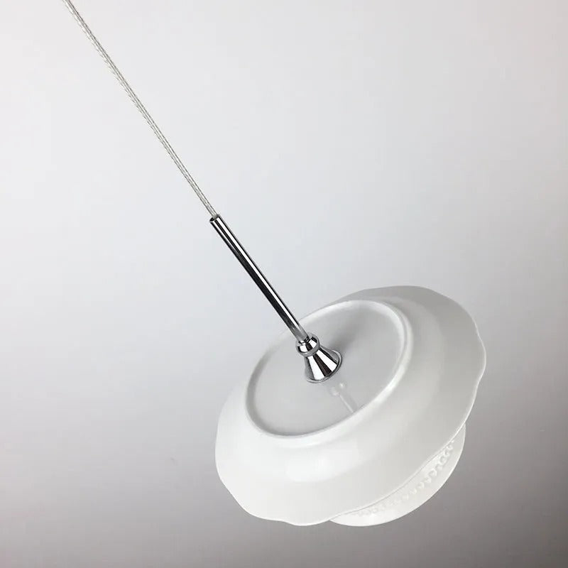 Second studio angle of the Clérachic pendant light, unlit on a white ground.