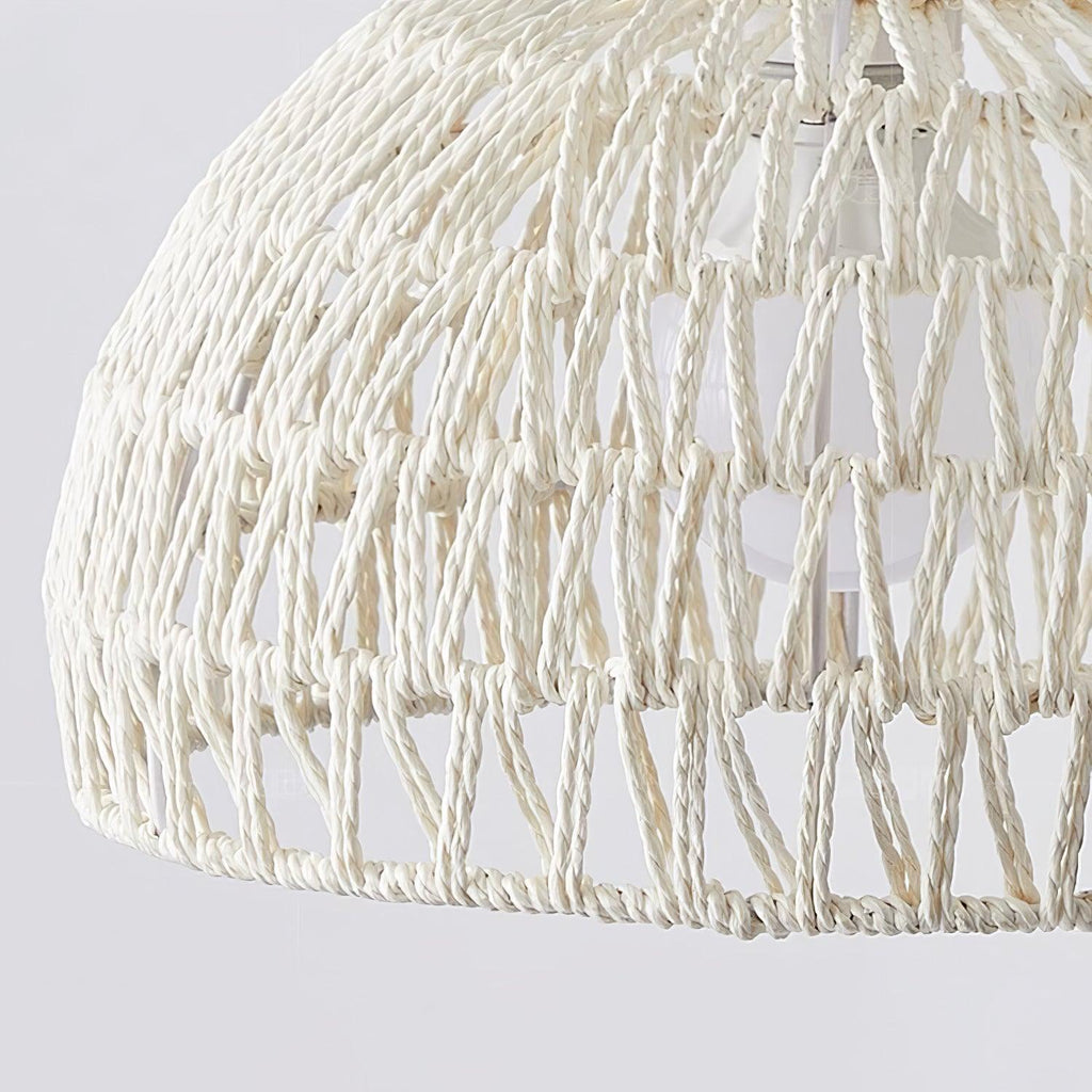 Close view of the twisted paper-rope weave on this Clérachic pendant, with open triangular gaps showing the lit inner shade.