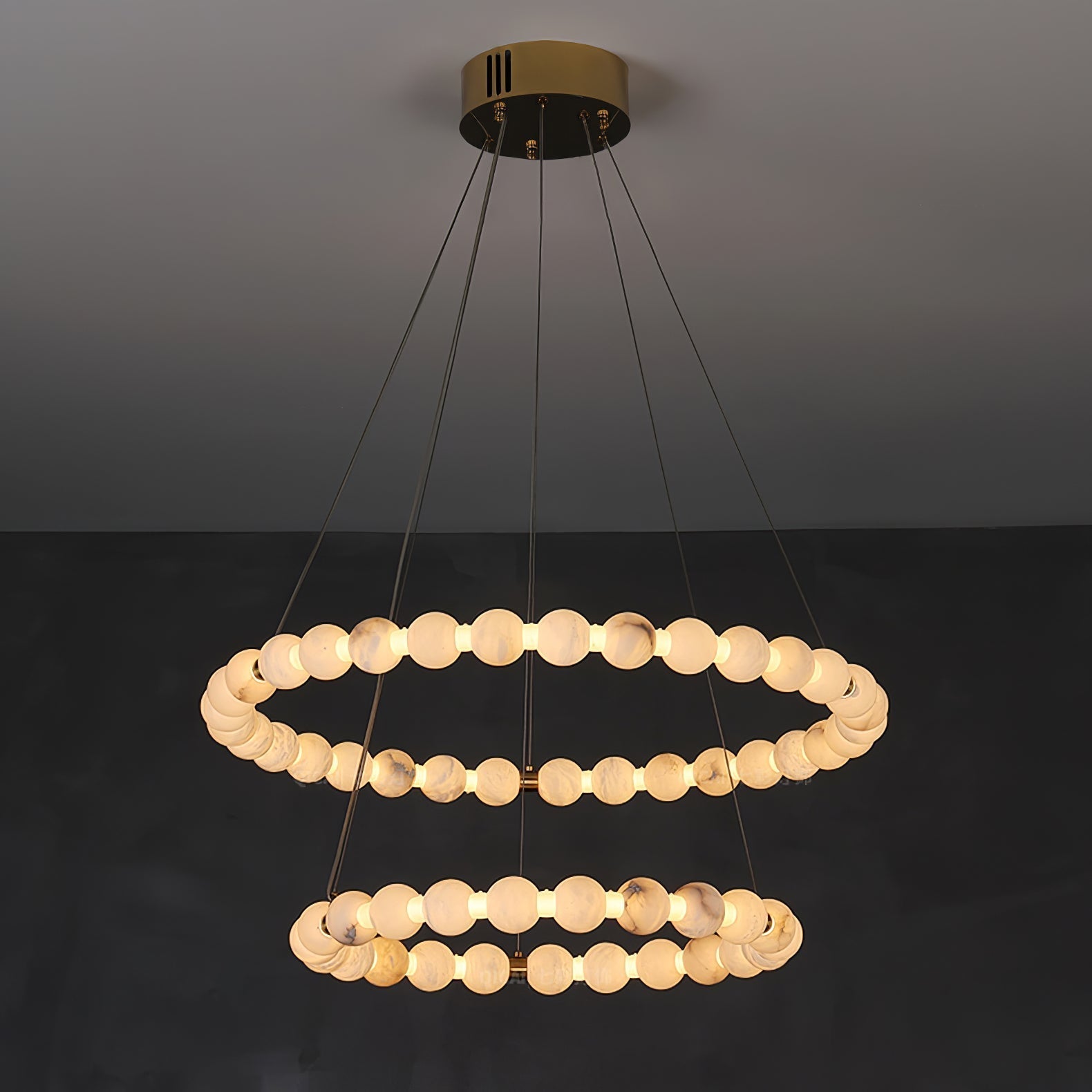 Clérachic Orb chandelier in a two-ring build, the smaller ring hanging beneath the larger.