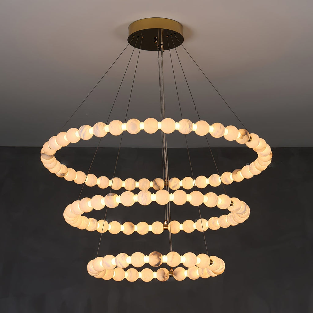 Clérachic Orb chandelier in a three-ring build, the tiers narrowing towards the floor.