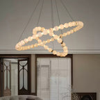 Clérachic Orb chandelier in a spiral build, curving above a panelled door and window blinds.