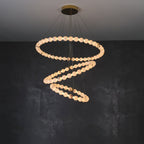 Clérachic Orb chandelier in a tall spiral against charcoal, beads descending in a helix.