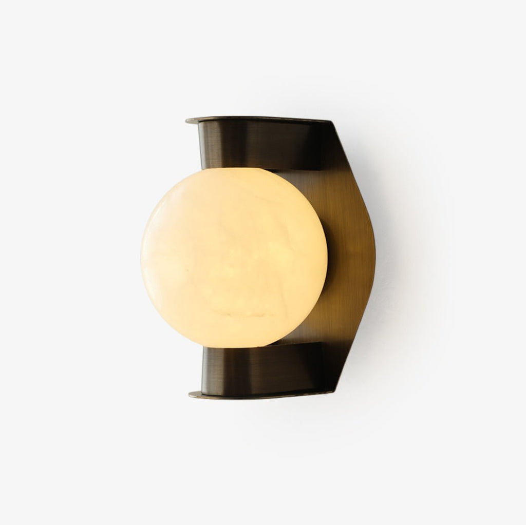 Clérachic Orb sconce on white, alabaster globe set against a faceted bronze backplate.