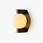 Clérachic Orb sconce on white, alabaster globe set against a faceted bronze backplate.