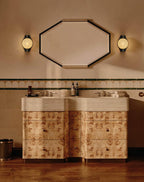 Clérachic Orb sconces in a bathroom with an octagonal mirror and patterned timber cabinetry.