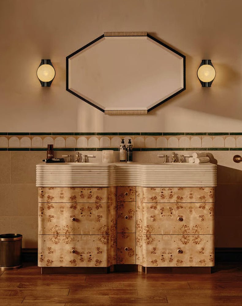 Clérachic Orb sconces in a bathroom with an octagonal mirror and patterned timber cabinetry.