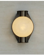 Clérachic Orb sconce photographed straight on, bronze plate framing the lit alabaster globe.