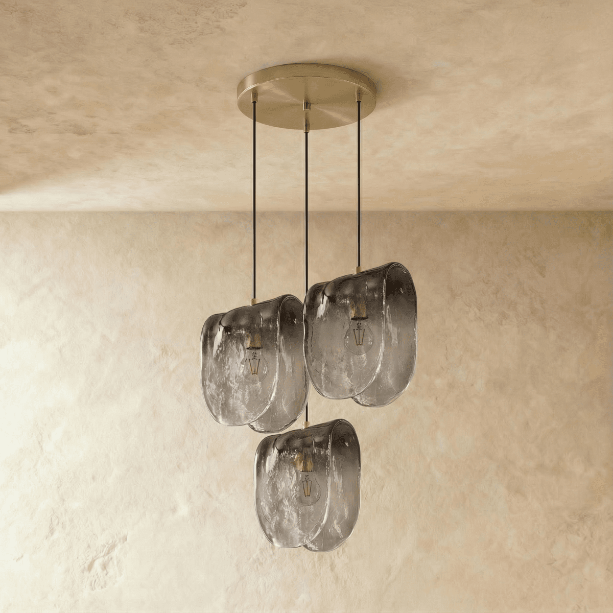 Clérachic three-head round pendant with smoke-grey gradient glass shades at varied heights from a brushed disc canopy.