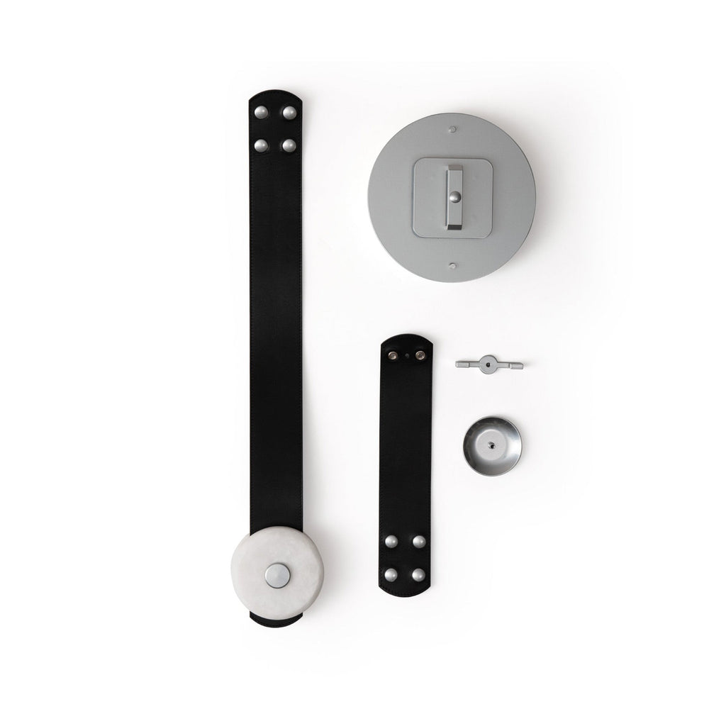 Clérachic Orinos parts laid out flat: black leather straps, the ceiling canopy plate, alabaster head and fixings.