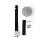 Clérachic Orinos parts laid out flat: black leather straps, the ceiling canopy plate, alabaster head and fixings.