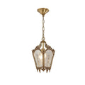 Clérachic brass lantern pendant with a domed ceiling canopy and a chain, seen on a plain white backdrop.