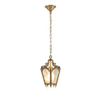Brass lantern pendant with a chain and a domed ceiling canopy, small in a white frame, from Clérachic.